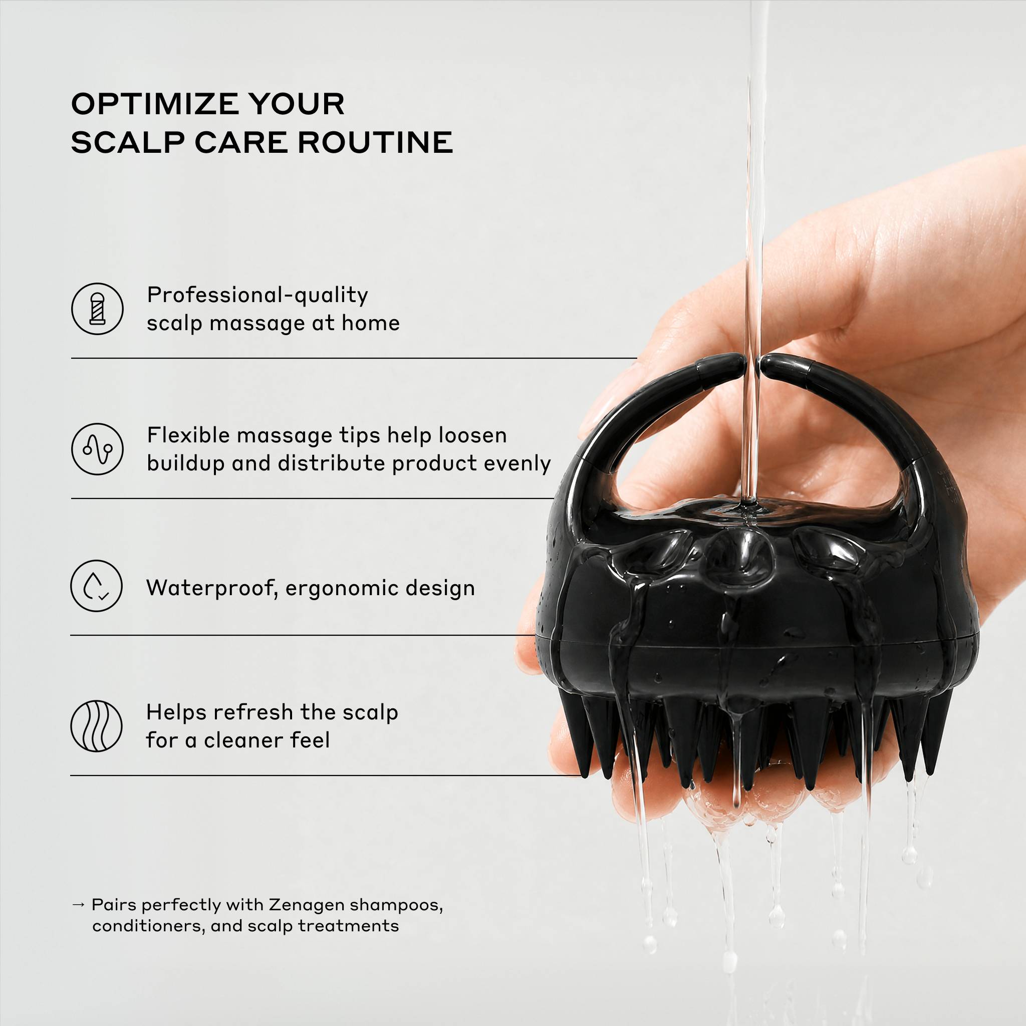 A hand holds a black scalp massage brush under running water on a light gray background with text describing scalp care benefits.